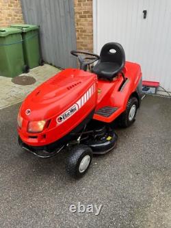 Oleo Mac Red sit on grass lawnmower, Briggs & Stratton engine