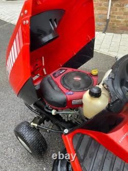 Oleo Mac Red sit on grass lawnmower, Briggs & Stratton engine