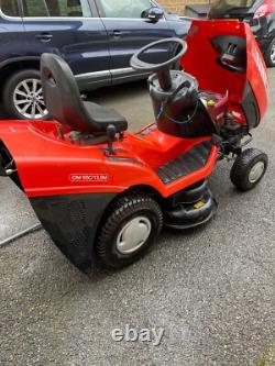 Oleo Mac Red sit on grass lawnmower, Briggs & Stratton engine