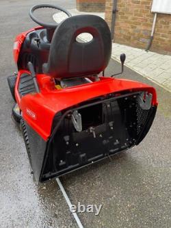 Oleo Mac Red sit on grass lawnmower, Briggs & Stratton engine