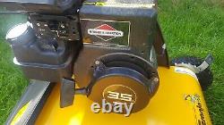 Petrol lawn mower scarifier