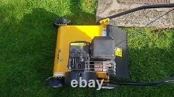 Petrol lawn mower scarifier