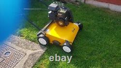 Petrol lawn mower scarifier