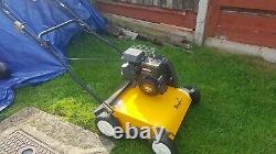 Petrol lawn mower scarifier